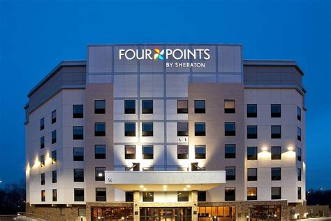 Modern rooms at Four Points By Sheraton feature floor-to-ceiling windows and light wood furnishings. . Four point by sheraton